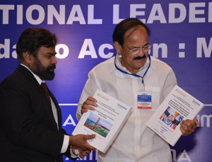 Solomon Darwin presenting the student projects with Venkaiah Naidu, India's minister of urban development. Courtesy photo