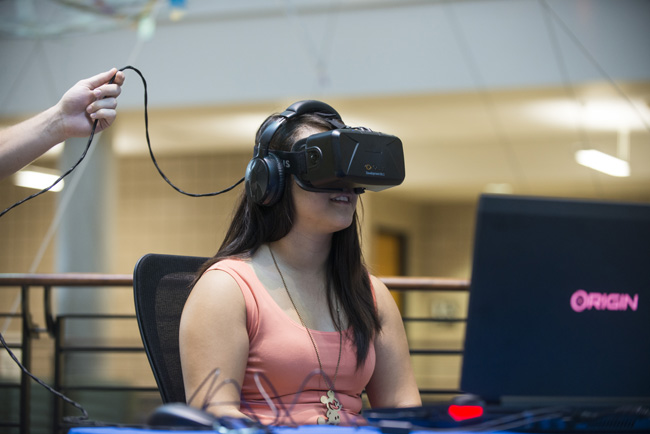 Juhyun Kwon, a marketing major at Minnesota's Carlson School of Management tries out General Mill's Oculus Rift at a recruiting event. Photo courtesy of Carlson School of Management